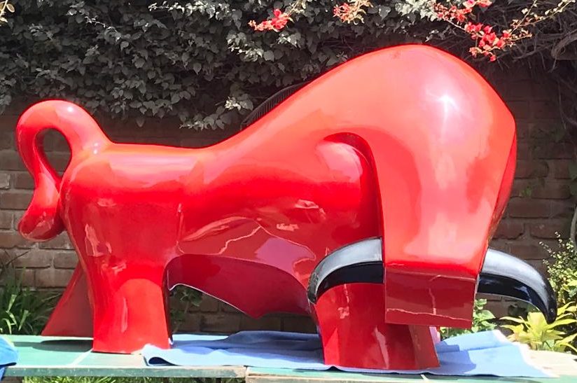 Made in glowing fiber-glass, the modern Pucara bull is seen in these images in a hot Ferrari red.